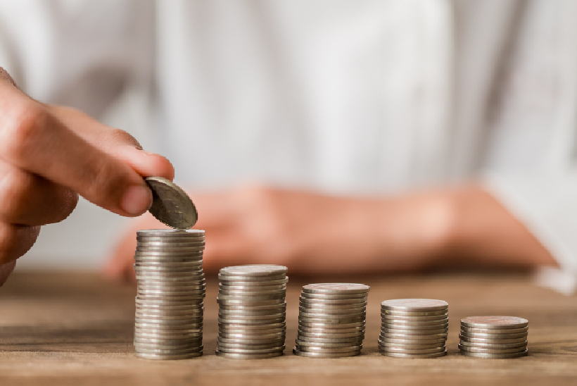 Hand putting money coin on each line rising